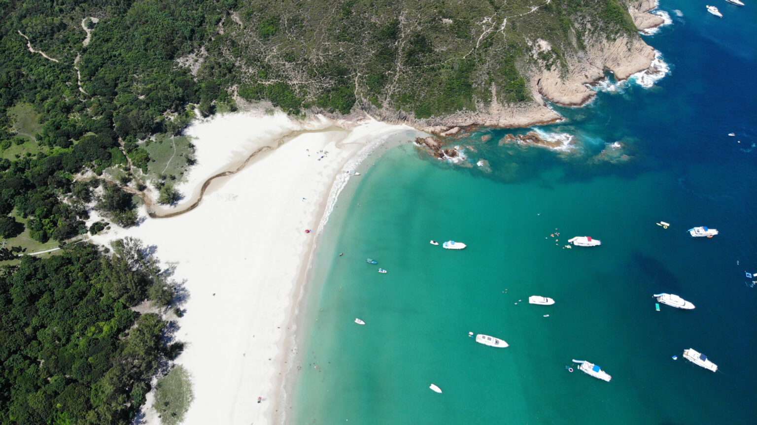 Image of Hong Kong Junks at the beach.